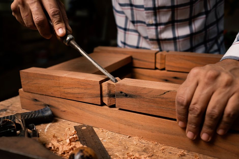Master woodworker crafting bespoke furniture